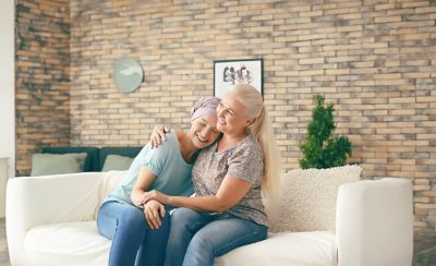 Mother with her daughter after chemotherapy at home